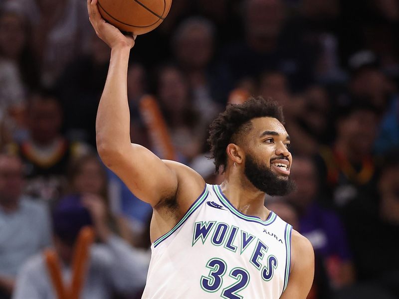 PHOENIX, ARIZONA - NOVEMBER 15: Karl-Anthony Towns #32 of the Minnesota Timberwolves looks to pass during the second half of the NBA game against the Phoenix Sunsat Footprint Center on November 15, 2023 in Phoenix, Arizona. The Suns defeated the Timberwolves 133-115. NOTE TO USER: User expressly acknowledges and agrees that, by downloading and or using this photograph, User is consenting to the terms and conditions of the Getty Images License Agreement.  (Photo by Christian Petersen/Getty Images)