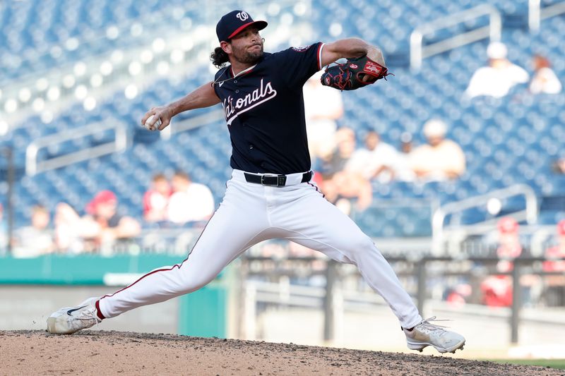 Jun 19, 2024; Washington, District of Columbia, USA; Washington Nationals closing pitcher Kyle Finnegan (67) pitches against the Arizona Diamondbacks during the ninth inning at Nationals Park. Mandatory Credit: Geoff Burke-USA TODAY Sports