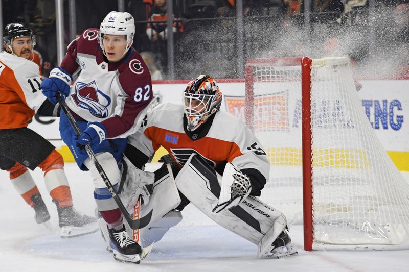 Nov 18, 2024; Philadelphia, Pennsylvania, USA; Colorado Avalanche center Ivan Ivan (82) battles for position with Philadelphia Flyers goaltender Aleksei Kolosov (35) during the second period at Wells Fargo Center. Mandatory Credit: Eric Hartline-Imagn Images