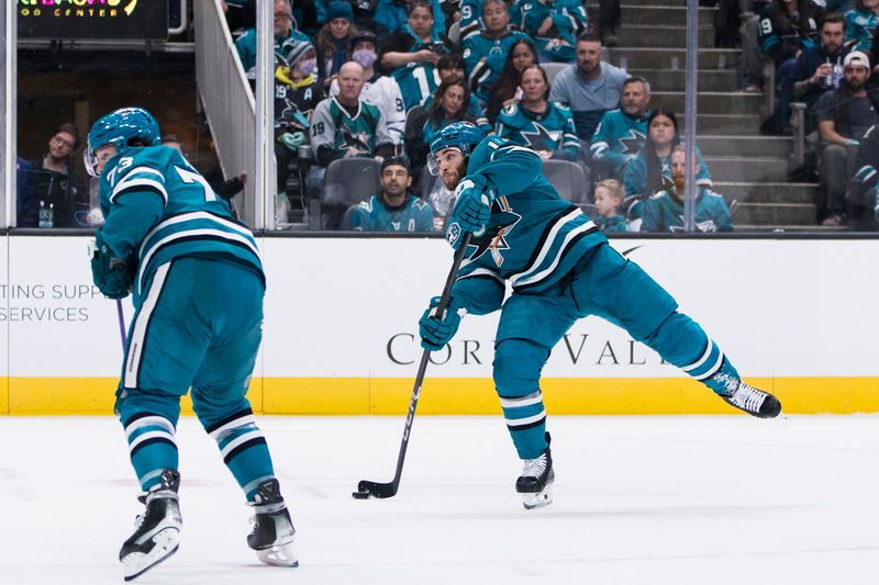 Nov 23, 2024; San Jose, California, USA;  San Jose Sharks center Luke Kunin (11) shoots against the Buffalo Sabres during the second period at SAP Center in San Jose. Mandatory Credit: John Hefti-Imagn Images