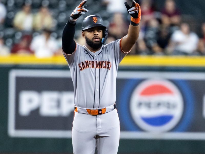 Sep 16, 2025; Phoenix, Arizona, USA; San Francisco Giants outfielder Heliot Ramos celebrates after hitting a double in the first inning against the Arizona Diamondbacks at Chase Field. Mandatory Credit: Mark J. Rebilas-Imagn Images