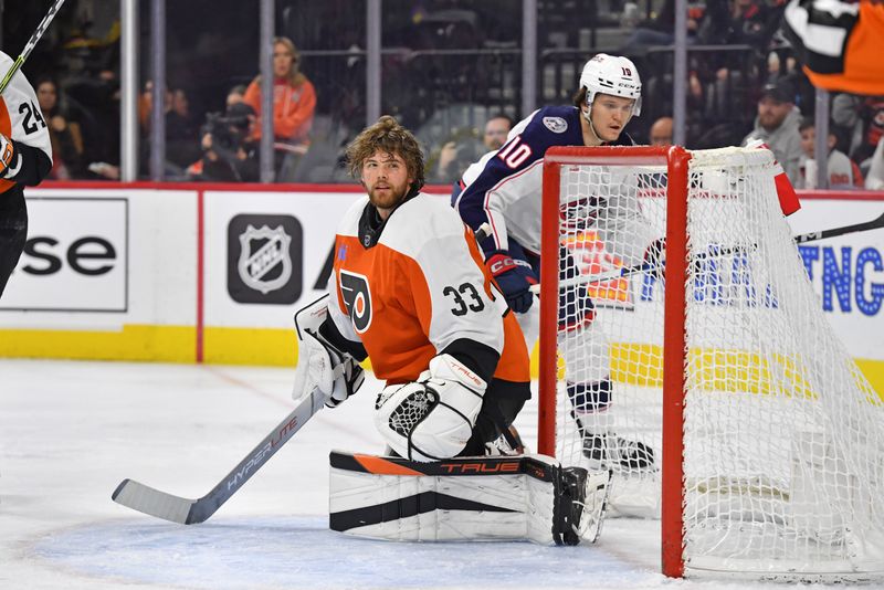 Jan 4, 2024; Philadelphia, Pennsylvania, USA; Philadelphia Flyers goaltender Samuel Ersson (33) reacts after losing his mask against the Columbus Blue Jackets during the second period at Wells Fargo Center. Mandatory Credit: Eric Hartline-USA TODAY Sports