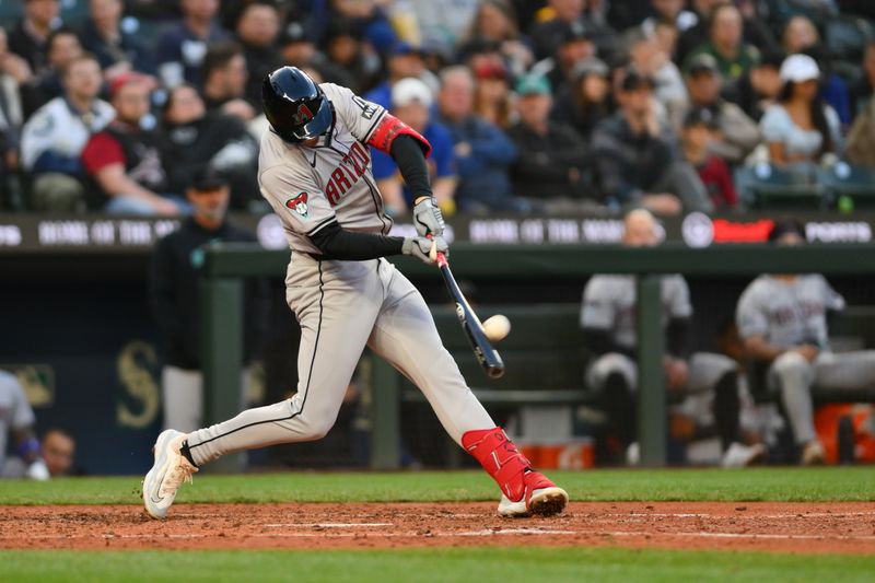 Apr 26, 2024; Seattle, Washington, USA; Arizona Diamondbacks shortstop Kevin Newman (18) hits a home run against the Seattle Mariners during the sixth inning at T-Mobile Park. Mandatory Credit: Steven Bisig-USA TODAY Sports