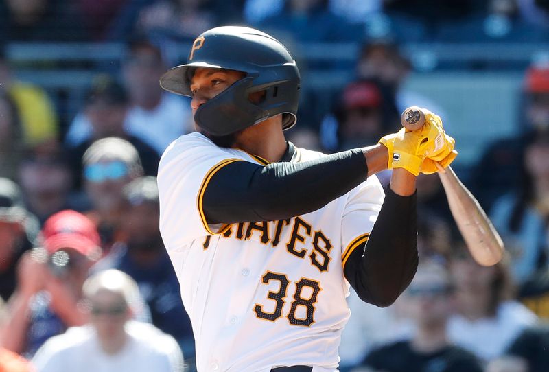 Apr 7, 2024; Pittsburgh, Pennsylvania, USA;  Pittsburgh Pirates designated hitter Edward Olivares (38) drives in the game winning runs against the Baltimore Orioles during the ninth inning at PNC Park. Mandatory Credit: Charles LeClaire-USA TODAY Sports