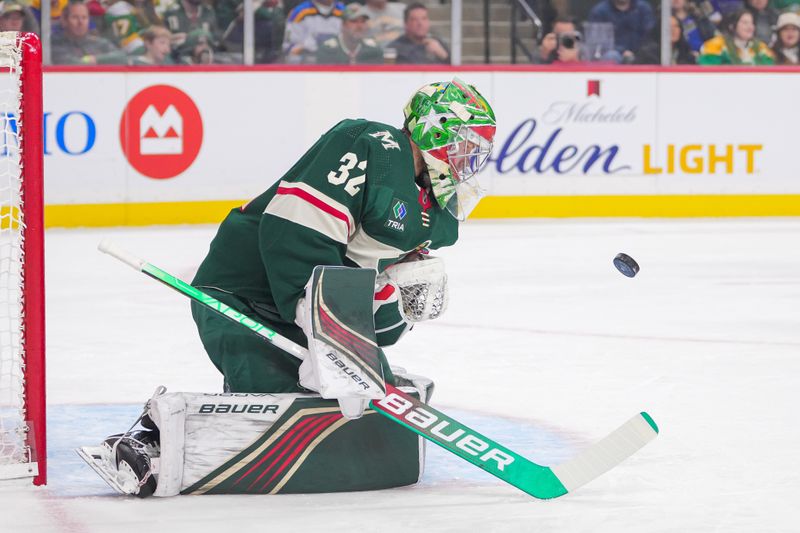 Nov 28, 2023; Saint Paul, Minnesota, USA; Minnesota Wild goaltender Filip Gustavsson (32) makes a save against the St. Louis Blues in the first period at Xcel Energy Center. Mandatory Credit: Brad Rempel-USA TODAY Sports