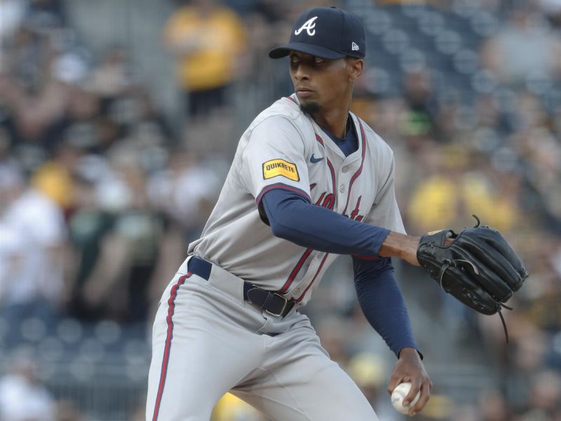 May 24, 2024; Pittsburgh, Pennsylvania, USA;  Atlanta Braves starting pitcher Ray Kerr (58) delivers a pitch against the Pittsburgh Pirates during the first inning at PNC Park. Mandatory Credit: Charles LeClaire-USA TODAY Sports