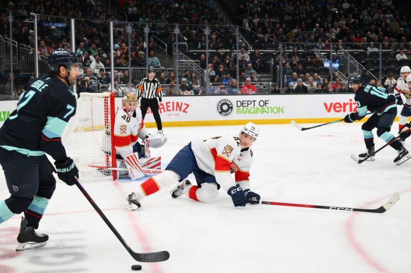 Mar 15, 2026; Seattle, Washington, USA; Florida Panthers defenseman Gustav Forsling (42) defends Seattle Kraken right wing Jordan Eberle (7) during the third period at Climate Pledge Arena. Mandatory Credit: Steven Bisig-Imagn Images
