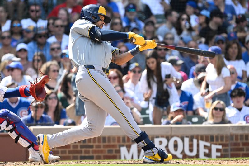 May 4, 2024; Chicago, Illinois, USA;  Milwaukee Brewers outfielder Blake Perkins (16) hits a two run home run against the Chicago Cubs during the seventh inning at Wrigley Field. Mandatory Credit: Matt Marton-USA TODAY Sports