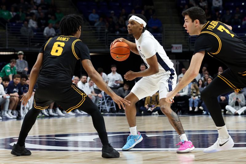 Feb 28, 2026; University Park, Pennsylvania, USA; Penn State Nittany Lions guard Kayden Mingo (4) dribbles the ball as Iowa Hawkeyes guard/forward Tavion Banks (6) and forward Alvaro Folgueiras (7) defend during the first half at Bryce Jordan Center. Mandatory Credit: Matthew O'Haren-Imagn Images