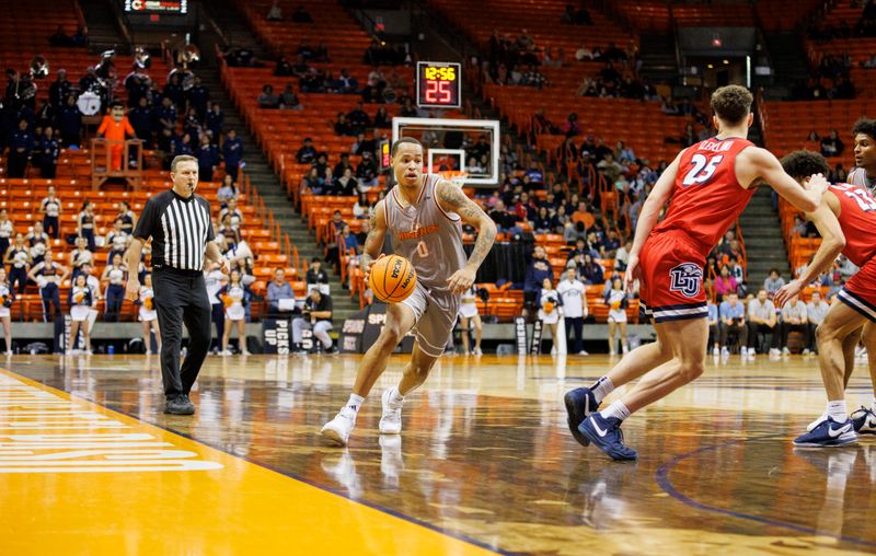 Feb 3, 2024; El Paso, Texas, USA; UTEP Miners guard Zid Powell (0) dribbles the ball against the Liberty University Flames defense in the second half at Don Haskins Center. Mandatory Credit: Ivan Pierre Aguirre-USA TODAY Sports