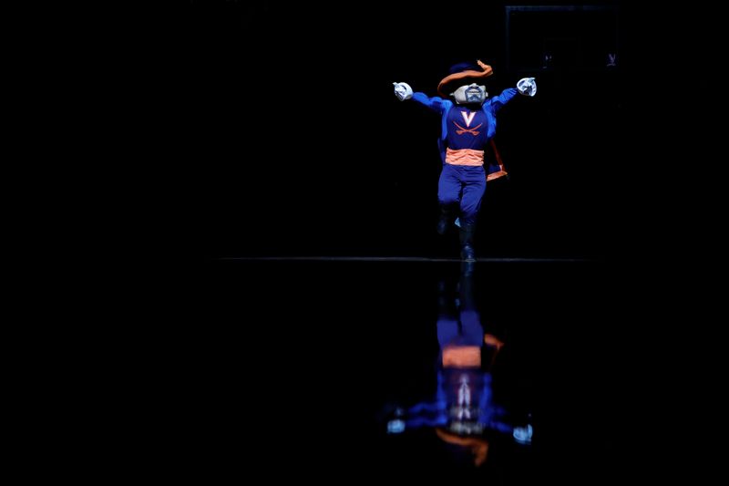 Dec 2, 2023; Charlottesville, Virginia, USA; Virginia Cavaliers mascot CavMan dances on the court prior to the Cavaliers' game against the Syracuse Orange at John Paul Jones Arena. Mandatory Credit: Geoff Burke-USA TODAY Sports