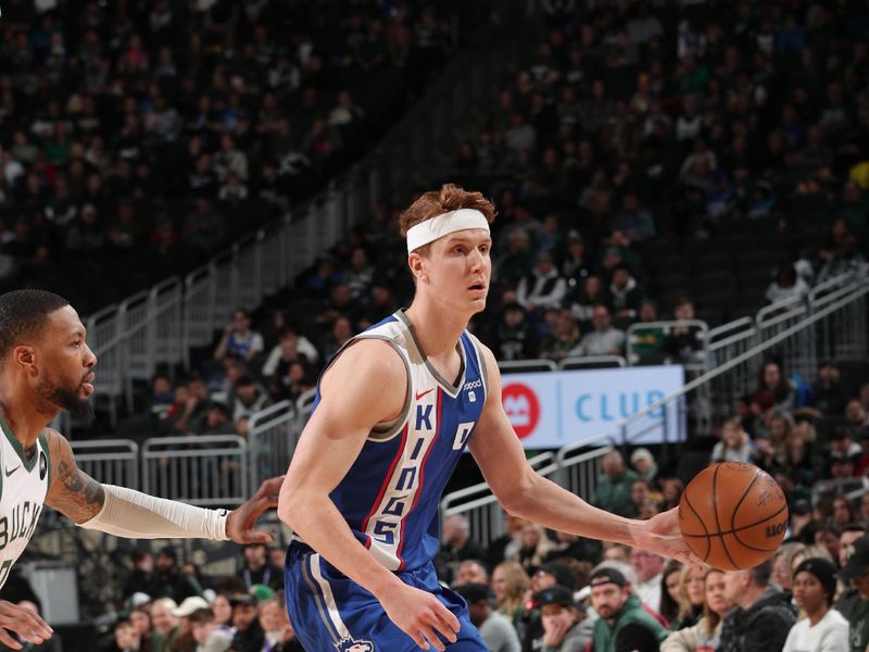 MILWAUKEE, WI - JANUARY 14: Kevin Huerter #9 of the Sacramento Kings dribbles the ball during the game against the Milwaukee Bucks on January 14, 2024 at the Fiserv Forum Center in Milwaukee, Wisconsin. NOTE TO USER: User expressly acknowledges and agrees that, by downloading and or using this Photograph, user is consenting to the terms and conditions of the Getty Images License Agreement. Mandatory Copyright Notice: Copyright 2024 NBAE (Photo by Gary Dineen/NBAE via Getty Images).