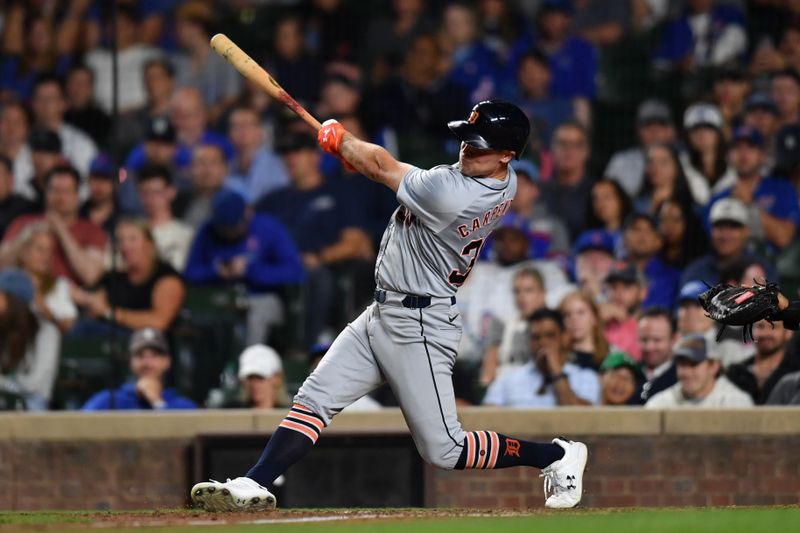 Aug 21, 2024; Chicago, Illinois, USA; Detroit Tigers right fielder Kerry Carpenter (30) hits a three-run home run during the ninth inning against the Chicago Cubs at Wrigley Field. Mandatory Credit: Patrick Gorski-USA TODAY Sports