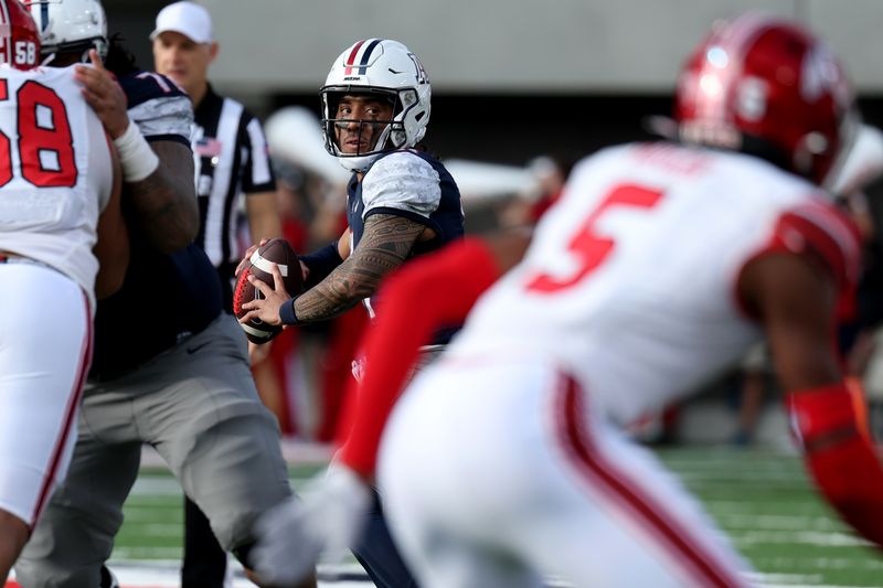 Nov 18, 2023; Tucson, Arizona, USA; Arizona Wildcats quarterback Noah Fifita (11) throws a pass against the Utah Utes during the second half at Arizona Stadium. Mandatory Credit: Zachary BonDurant-USA TODAY Sports