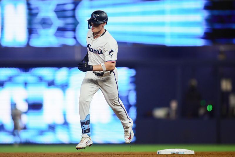 Sep 19, 2024; Miami, Florida, USA; Miami Marlins right fielder Griffin Conine (56) circles the bases after hitting a two-run home run against the Los Angeles Dodgers during the fifth inning at loanDepot Park. Mandatory Credit: Sam Navarro-Imagn Images