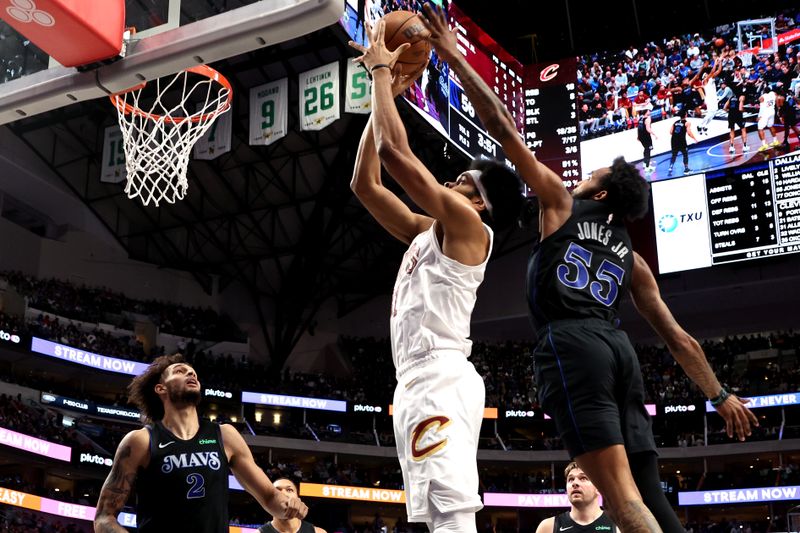 DALLAS, TEXAS - DECEMBER 27: Jarrett Allen #31 of the Cleveland Cavaliers has his shot blocked by Derrick Jones Jr. #55 of the Dallas Mavericks in the first half at American Airlines Center on December 27, 2023 in Dallas, Texas. NOTE TO USER: User expressly acknowledges and agrees that, by downloading and or using this photograph, User is consenting to the terms and conditions of the Getty Images License Agreement. (Photo by Tim Heitman/Getty Images)