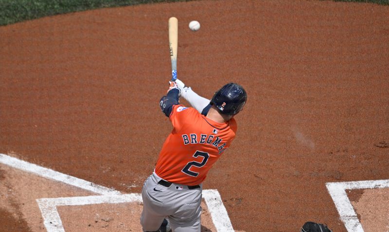 Jul 4, 2024; Toronto, Ontario, CAN; Houston Astros third baseman Alex Bregman (2) hits a single against the Toronto Blue Jays in the first inning at Rogers Centre. Mandatory Credit: Dan Hamilton-USA TODAY Sports