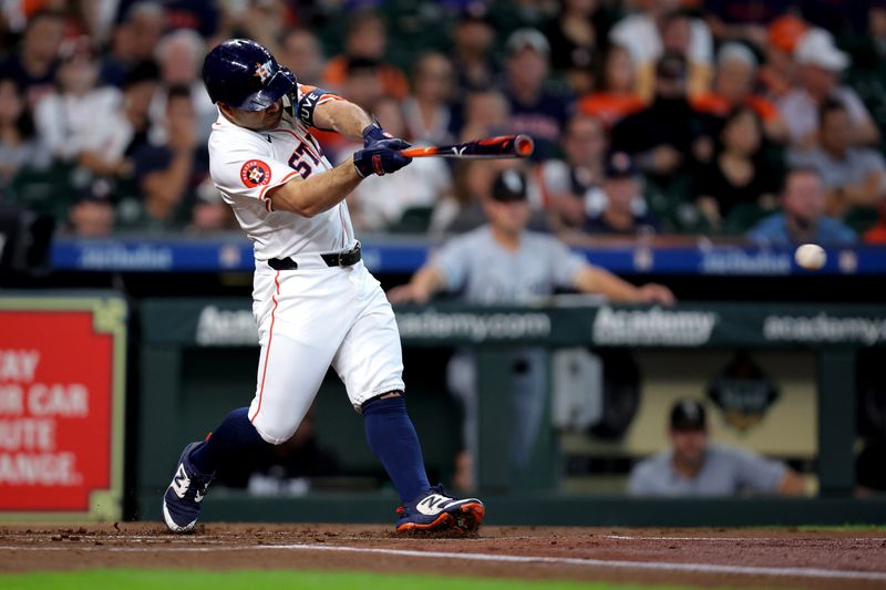 Aug 18, 2024; Houston, Texas, USA; Houston Astros designated hitter Jose Altuve (27) hits a single against the Chicago White Sox during the first inning at Minute Maid Park. Mandatory Credit: Erik Williams-USA TODAY Sports