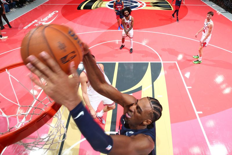 WASHINGTON, DC -? NOVEMBER 26: Alexandre Sarr #20 of the Washington Wizards dunks the ball during the game against the Chicago Bulls during the Emirates NBA Cup game on November 26, 2024 at Capital One Arena in Washington, DC. NOTE TO USER: User expressly acknowledges and agrees that, by downloading and or using this Photograph, user is consenting to the terms and conditions of the Getty Images License Agreement. Mandatory Copyright Notice: Copyright 2024 NBAE (Photo by Stephen Gosling/NBAE via Getty Images)