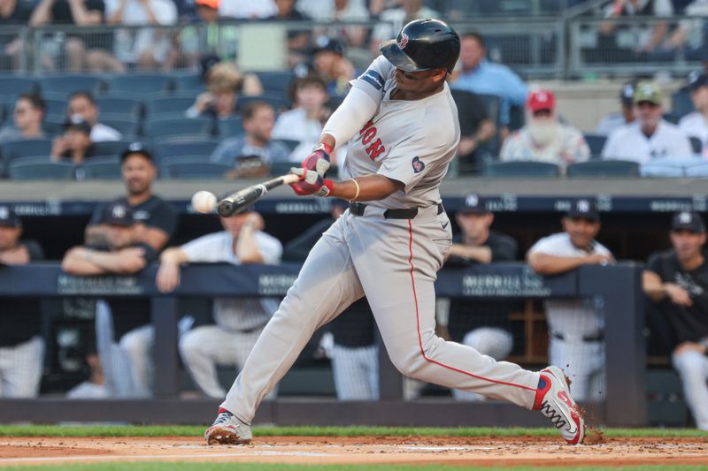 Jul 7, 2024; Bronx, New York, USA; Boston Red Sox third baseman Rafael Devers (11) singles during the second inning against the New York Yankees at Yankee Stadium. Mandatory Credit: Vincent Carchietta-USA TODAY Sports