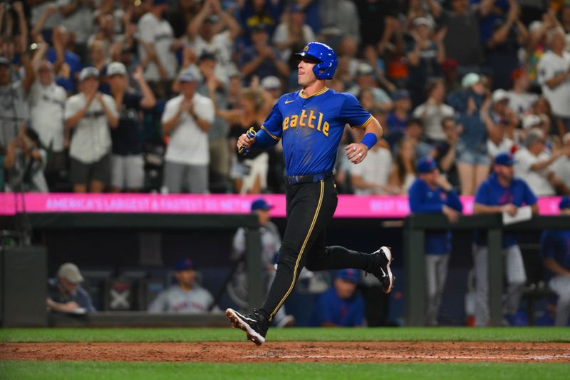 Aug 9, 2024; Seattle, Washington, USA; Seattle Mariners third baseman Dylan Moore (25) scores a run against the New York Mets during the seventh inning at T-Mobile Park. Mandatory Credit: Steven Bisig-USA TODAY Sports