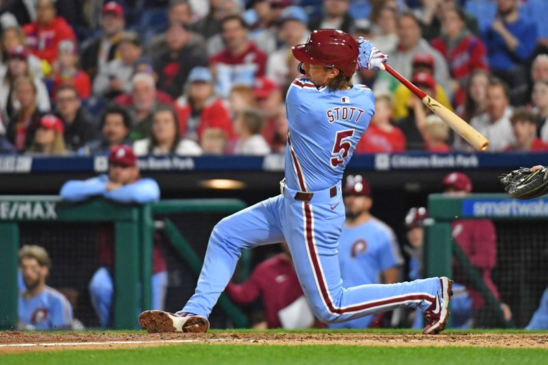 Apr 11, 2024; Philadelphia, Pennsylvania, USA; Philadelphia Phillies second base Bryson Stott (5) hits a two run home run against the Pittsburgh Pirates during the seventh inning at Citizens Bank Park. Mandatory Credit: Eric Hartline-USA TODAY Sports