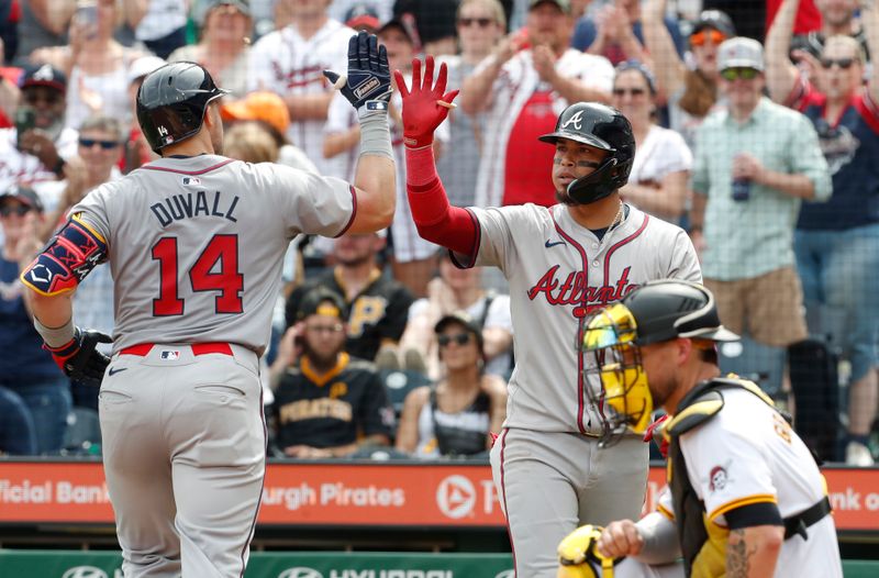 May 26, 2024; Pittsburgh, Pennsylvania, USA;  Atlanta Braves Orlando Arcia (right) congratulates right fielder Adam Duvall (14) on his solo home run against the Pittsburgh Pirates during the eighth inning at PNC Park. Atlanta won 8-1. Mandatory Credit: Charles LeClaire-USA TODAY Sports