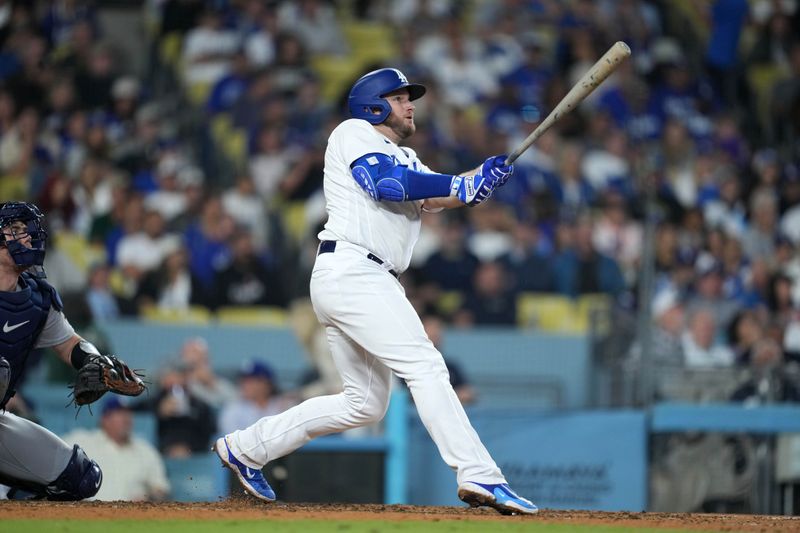 Sep 20, 2023; Los Angeles, California, USA; Los Angeles Dodgers third baseman Max Muncy (13) hits a home run in the sixth inning against the Detroit Tigers at Dodger Stadium. Mandatory Credit: Kirby Lee-USA TODAY Sports