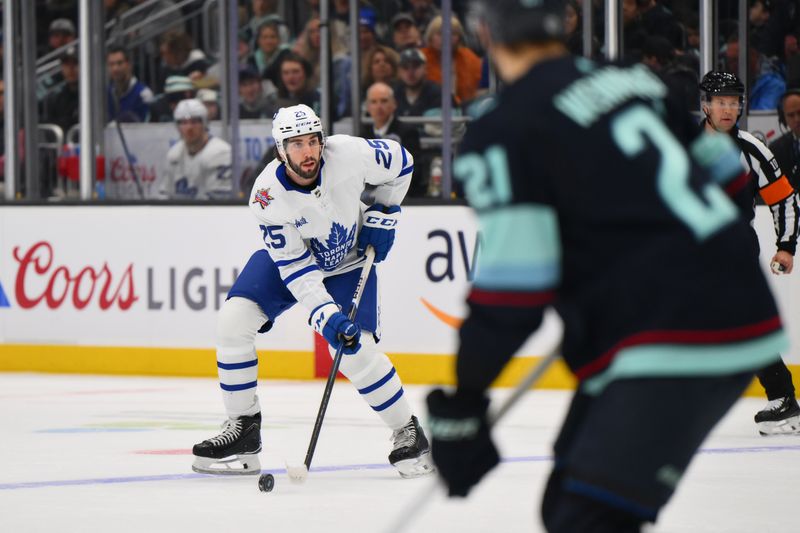 Jan 21, 2024; Seattle, Washington, USA; Toronto Maple Leafs defenseman Conor Timmins (25) looks to pass the puck against the Seattle Kraken during the first period at Climate Pledge Arena. Mandatory Credit: Steven Bisig-USA TODAY Sports