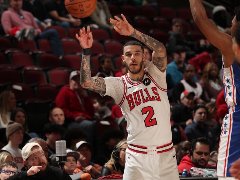 CHICAGO, IL - DECEMBER 8: Lonzo Ball #2 of the Chicago Bulls passes the ball during the game against the Philadelphia 76ers on December 8, 2024 at United Center in Chicago, Illinois. NOTE TO USER: User expressly acknowledges and agrees that, by downloading and or using this photograph, User is consenting to the terms and conditions of the Getty Images License Agreement. Mandatory Copyright Notice: Copyright 2024 NBAE (Photo by Gary Dineen/NBAE via Getty Images)