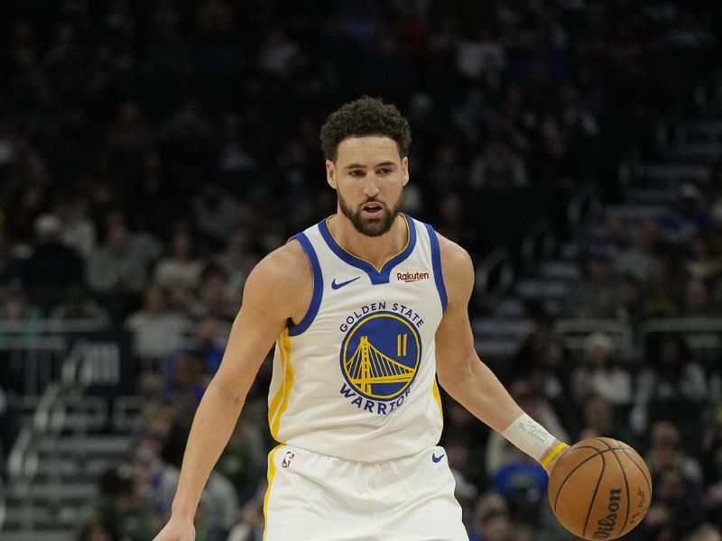 MILWAUKEE, WISCONSIN - JANUARY 13: Klay Thompson #11 of the Golden State Warriors dribbles the ball in the first half against the Milwaukee Bucks at Fiserv Forum on January 13, 2024 in Milwaukee, Wisconsin. NOTE TO USER: User expressly acknowledges and agrees that, by downloading and or using this photograph, User is consenting to the terms and conditions of the Getty Images License Agreement. (Photo by Patrick McDermott/Getty Images)