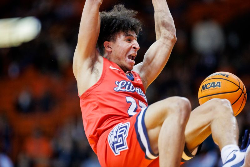 Feb 3, 2024; El Paso, Texas, USA; Liberty University Flames guard Joseph Venzant (23) dunks the ball against the UTEP Miners in the first half at Don Haskins Center. Mandatory Credit: Ivan Pierre Aguirre-USA TODAY Sports