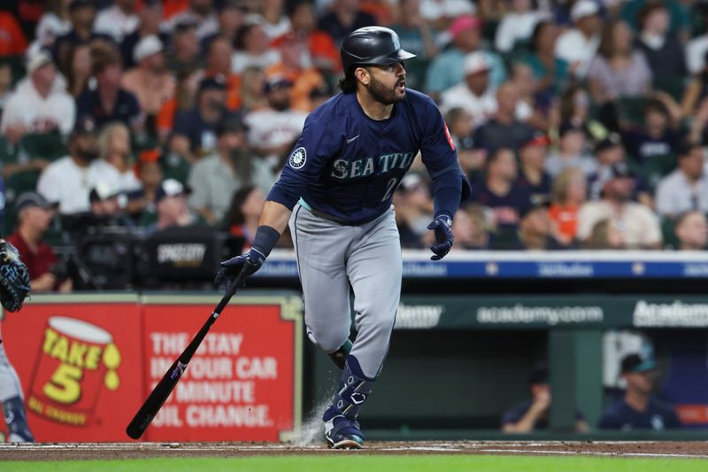 Sep 20, 2025; Houston, Texas, USA; Seattle Mariners third baseman Eugenio Suarez (28) hits an RBI double during the first inning against the Houston Astros at Daikin Park. Mandatory Credit: Troy Taormina-Imagn Images