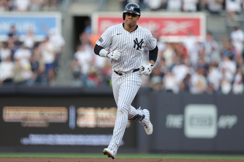 May 8, 2024; Bronx, New York, USA; New York Yankees right fielder Juan Soto (22) rounds the bases after hitting a two run home run against the Houston Astros during the first inning at Yankee Stadium. Mandatory Credit: Brad Penner-USA TODAY Sports