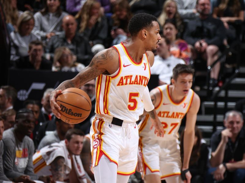 SALT LAKE CITY, UT - MARCH 15:  Dejounte Murray #5 of the Atlanta Hawks handles the ball during the game  on March 15, 2024 at Delta Center in Salt Lake City, Utah. NOTE TO USER: User expressly acknowledges and agrees that, by downloading and or using this Photograph, User is consenting to the terms and conditions of the Getty Images License Agreement. Mandatory Copyright Notice: Copyright 2024 NBAE (Photo by Melissa Majchrzak/NBAE via Getty Images)