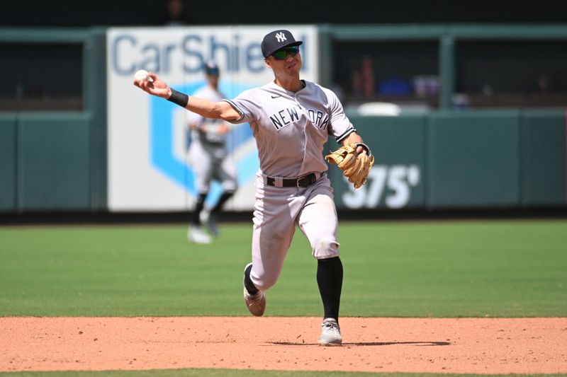 Jul 2, 2023; St. Louis, Missouri, USA; New York Yankees shortstop Anthony Volpe (11) throws to first for an out against the St. Louis Cardinals in the eighth inning at Busch Stadium. Mandatory Credit: Joe Puetz-USA TODAY Sports