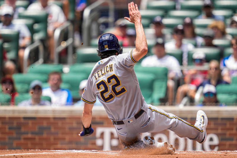 Jul 30, 2023; Cumberland, Georgia, USA; Milwaukee Brewers left fielder Christian Yelich (22) scores after a wild pitch against the Atlanta Braves during the first inning at Truist Park. Mandatory Credit: Dale Zanine-USA TODAY Sports