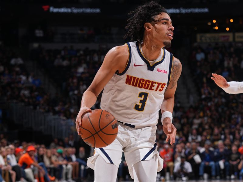 DENVER, CO - OCTOBER 13: Julian Strawther #3 of the Denver Nuggets dribbles the ball during the game against the Phoenix Suns on October 13, 2024 at Ball Arena in Denver, Colorado. NOTE TO USER: User expressly acknowledges and agrees that, by downloading and/or using this Photograph, user is consenting to the terms and conditions of the Getty Images License Agreement. Mandatory Copyright Notice: Copyright 2024 NBAE (Photo by Bart Young/NBAE via Getty Images)