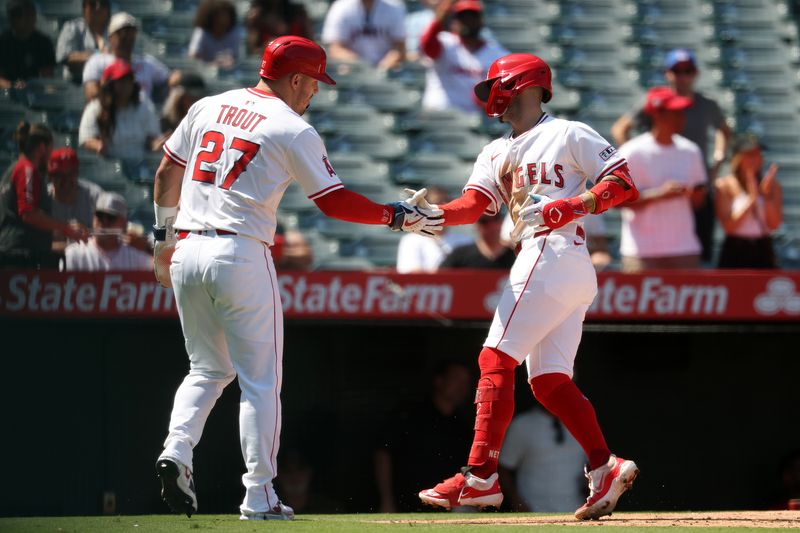 Sep 10, 2025; Anaheim, California, USA;  Los Angeles Angels shortstop Zach Neto (9) is greeted by designated hitter Mike Trout (27) after hitting a two-run home run during the third inning against the Minnesota Twins at Angel Stadium. Mandatory Credit: Kiyoshi Mio-Imagn Images