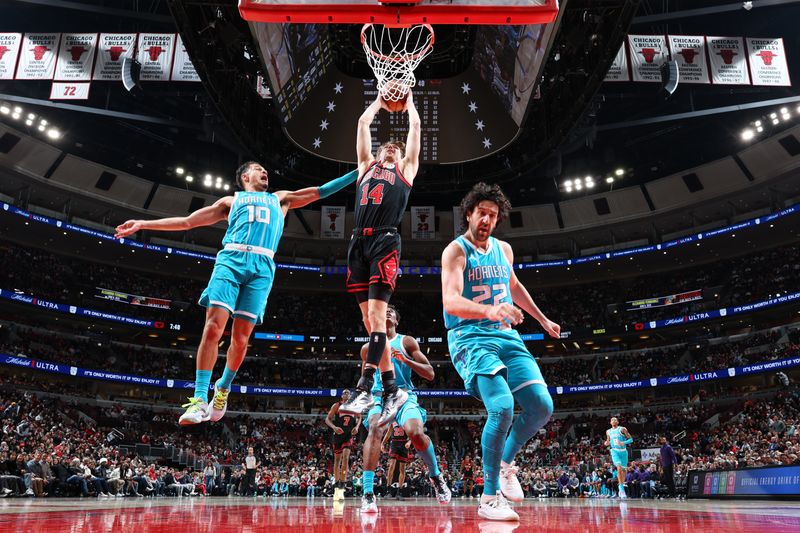 CHICAGO, IL - JANUARY 17: Matas Buzelis #14 of Chicago Bulls dunks the ball during the game against the Charlotte Hornets on January 17, 2025 at United Center in Chicago, Illinois. NOTE TO USER: User expressly acknowledges and agrees that, by downloading and or using this photograph, User is consenting to the terms and conditions of the Getty Images License Agreement. Mandatory Copyright Notice: Copyright 2025 NBAE (Photo by Jeff Haynes/NBAE via Getty Images)