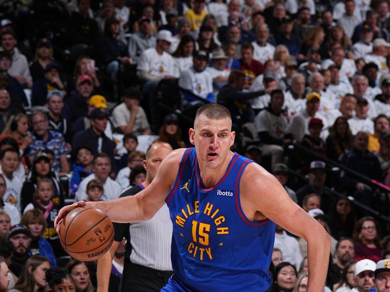 DENVER, CO - APRIL 20: Nikola Jokic #15 of the Denver Nuggets dribbles the ball during the game against the Los Angeles Lakers during Round 1 Game 1 of the 2024 NBA Playoffs on April 20, 2024 at the Ball Arena in Denver, Colorado. NOTE TO USER: User expressly acknowledges and agrees that, by downloading and/or using this Photograph, user is consenting to the terms and conditions of the Getty Images License Agreement. Mandatory Copyright Notice: Copyright 2024 NBAE (Photo by Garrett Ellwood/NBAE via Getty Images)