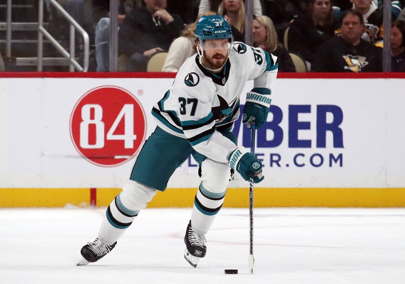 Nov 16, 2024; Pittsburgh, Pennsylvania, USA;  San Jose Sharks defenseman Timothy Liljegren (37) skates up ice with the puck against the Pittsburgh Penguins during the second period at PPG Paints Arena. Mandatory Credit: Charles LeClaire-Imagn Images