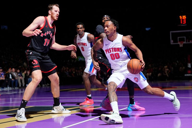 TORONTO, CANADA - NOVEMBER 15: Jalen Duren #0 of the Detroit Pistons drives to the basket during the game against the Toronto Raptors during the Emirates NBA CUP game  on November 15, 2024 at the Scotiabank Arena in Toronto, Ontario, Canada.  NOTE TO USER: User expressly acknowledges and agrees that, by downloading and or using this Photograph, user is consenting to the terms and conditions of the Getty Images License Agreement.  Mandatory Copyright Notice: Copyright 2024 NBAE (Photo by Mark Blinch/NBAE via Getty Images)