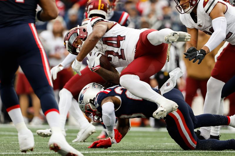 Washington Commanders' Antonio Gibson gets upended against the New England Patriots during an NFL football game at Gillette Stadium, Sunday Nov. 5, 2023 in Foxborough, Mass. (Winslow Townson/AP Images for Panini)