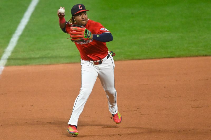 Apr 29, 2025; Cleveland, Ohio, USA; Cleveland Guardians third baseman Jose Ramirez (11) throws to first base in the second inning against the Minnesota Twins at Progressive Field. Mandatory Credit: David Richard-Imagn Images