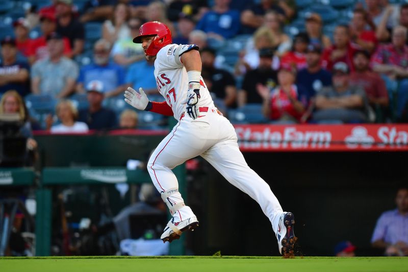 Sep 9, 2025; Anaheim, California, USA; Los Angeles Angels designated hitter Mike Trout (27) runs after hitting a single against the Minnesota Twins during the first inning at Angel Stadium. Mandatory Credit: Gary A. Vasquez-Imagn Images