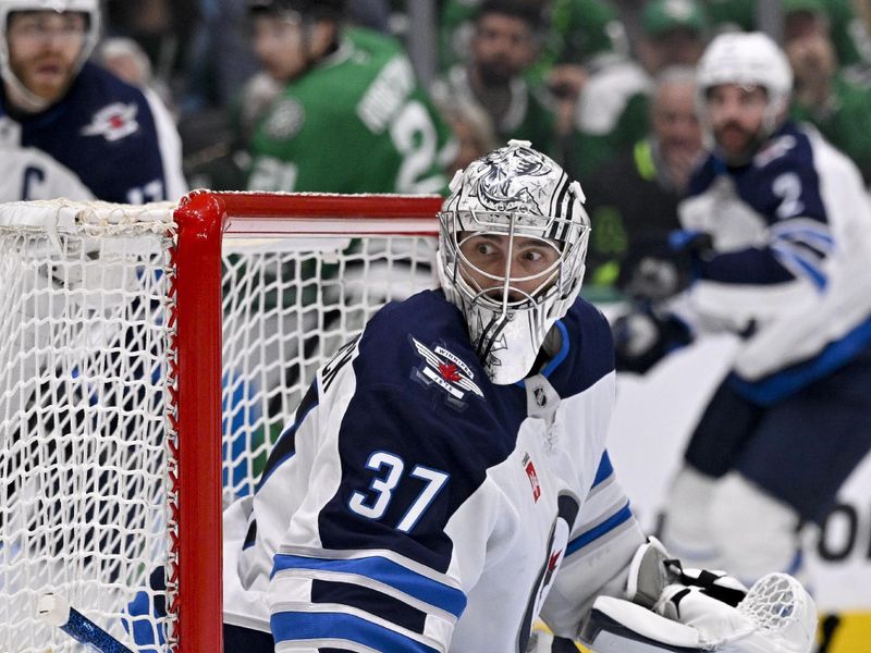 May 13, 2025; Dallas, Texas, USA; Winnipeg Jets goaltender Connor Hellebuyck (37) faces the Dallas Stars attack during the second period in game four of the second round of the 2025 Stanley Cup Playoffs at American Airlines Center. Mandatory Credit: Jerome Miron-Imagn Images