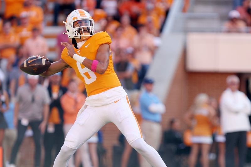 Oct 19, 2024; Knoxville, Tennessee, USA; Tennessee Volunteers linebacker Kalib Perry (8) passes the ball against the Alabama Crimson Tide during the first quarter at Neyland Stadium. Mandatory Credit: Alan Poizner-Imagn Images