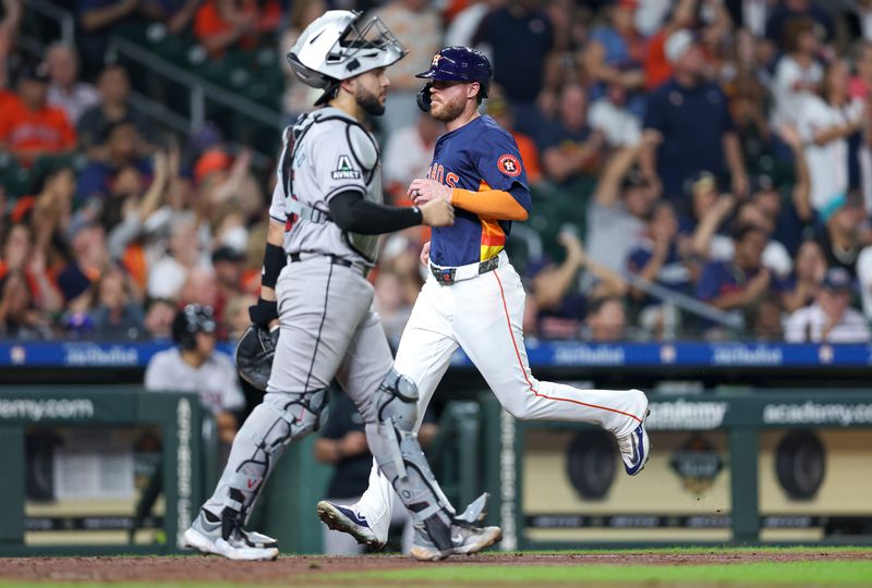 Sep 8, 2024; Houston, Texas, USA; Houston Astros right fielder Ben Gamel (12) scores a run past Arizona Diamondbacks catcher Adrian Del Castillo (25) during the fifth inning at Minute Maid Park. Mandatory Credit: Troy Taormina-Imagn Images