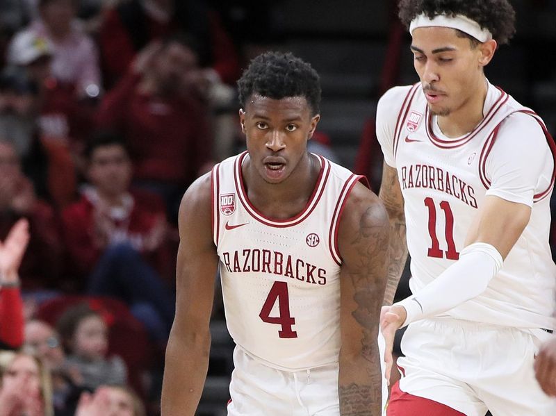 Nov 16, 2022; Fayetteville, Arkansas, USA; Arkansas Razorbacks guard Davonte Davis (4) gestures after making a three point shot in the first half against the South Dakota State Jackrabbits at Bud Walton Arena. Mandatory Credit: Nelson Chenault-USA TODAY Sports